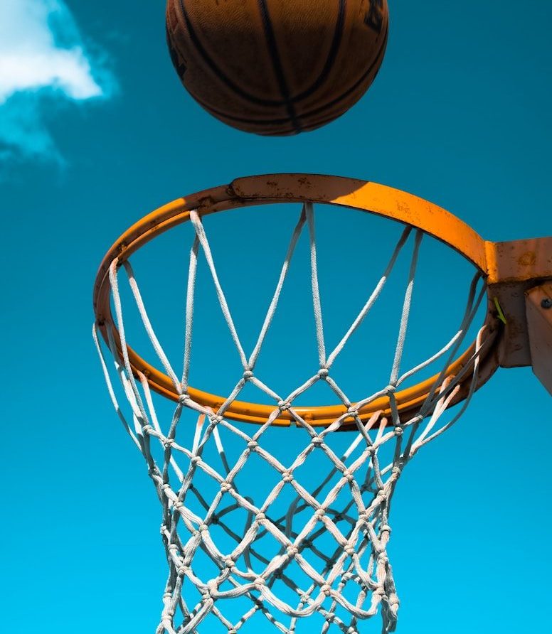 brown basketball near ring